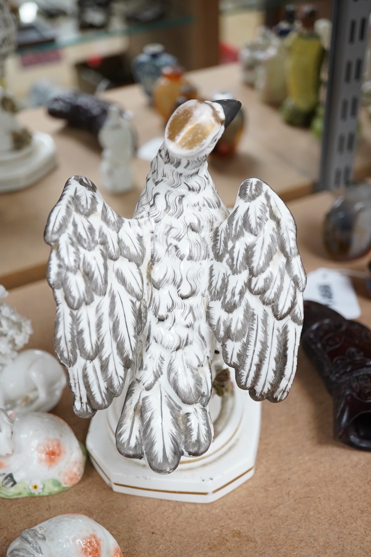 A rare Staffordshire porcelain model of an eagle or vulture, c.1830-50, and five Derby porcelain models, 1810–30; two recumbent sheep, a pug dog, a deer and a dove, 20cm high